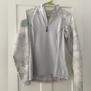 Woman’s 1/4 zip utility jacket designed to be a Mid layer for cold temps.